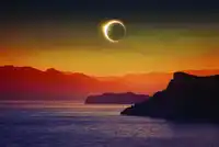 Full Solar Eclipse Over Mountains And Sea Igor ZH Shutterstock Scaled
